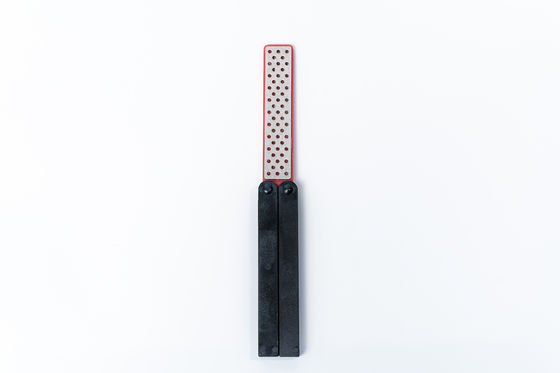 Piedra de afilar echada a un lado doble del cuchillo que dobla a Diamond Sharpener Polish Camping